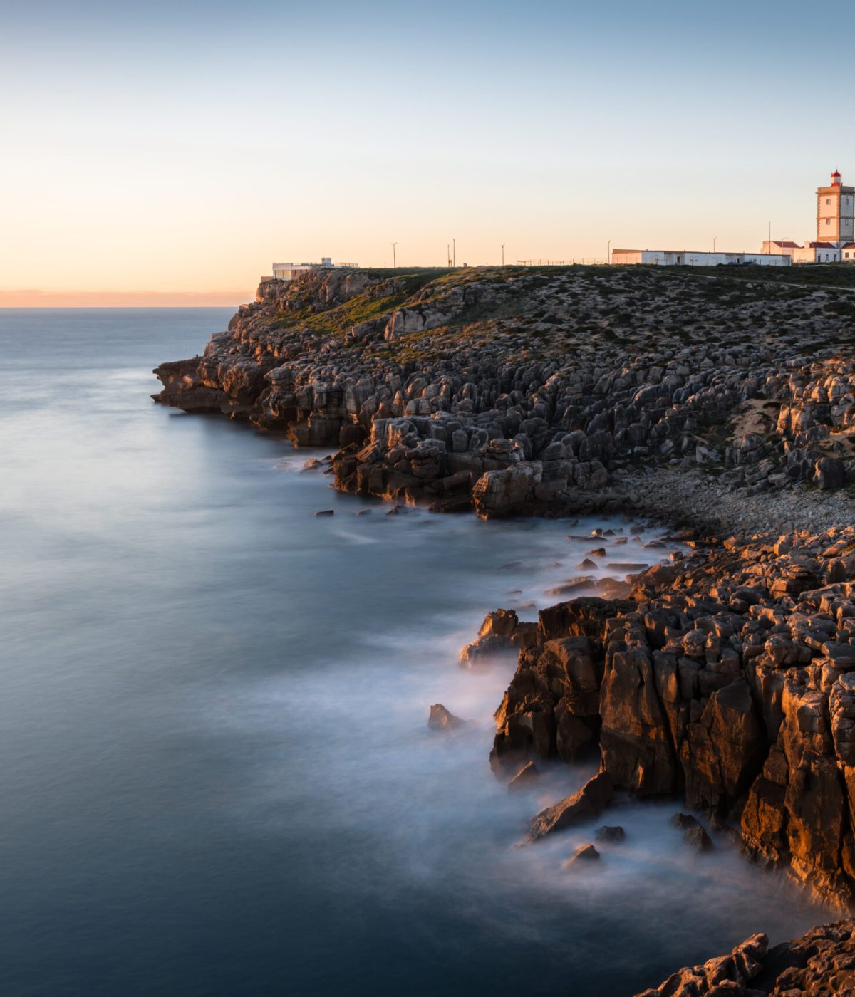 THE EDGE OF THE CONTINENT
    Witness the dramatic majesty of Cabo Carvoeiro’s unique rock formations and the iconic lighthouse, standing guard over the rugged Atlantic horizon.
