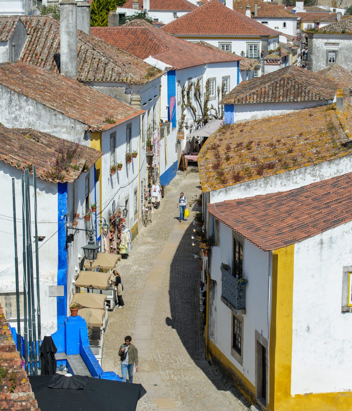 EXPLORE THE MEDIEVAL CITY OF ÓBIDOS
    Step back in time within historic, crenellated walls. Discover cobblestone streets lined with whitewashed houses, vibrant bougainvillea, and a stunning 12th-century castle rising over the valley.