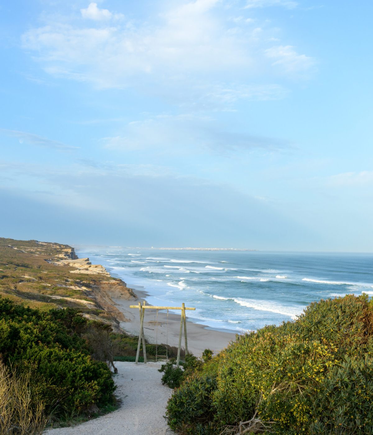 DISCOVER PRAIA DO BOM SUCESSO
    Experience where the tranquil lagoon meets the rolling Atlantic dunes. This peaceful shoreline offers calm, shallow waters on the inner side, perfect for relaxed days and scenic coastal walks.